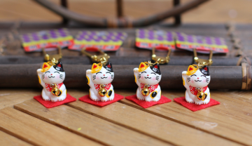Cat keychain with bell in row